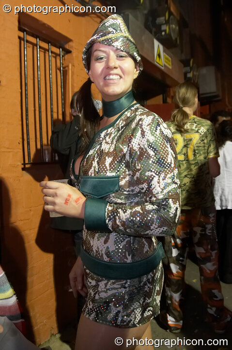 A woman in sparkly camo dress outside the Pukka / Interpole / Mindscapes Halloween party. London, Great Britain. © 2007 Photographicon