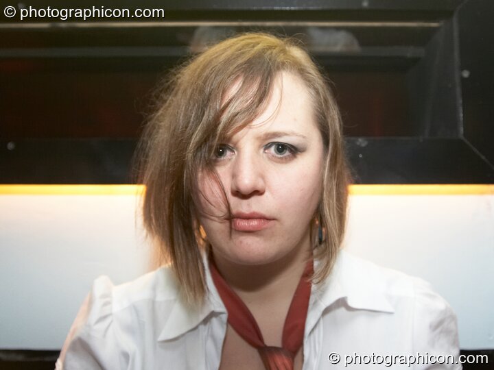 A woman stares for the camera at Dave Green's birthday party. London, Great Britain. © 2007 Photographicon