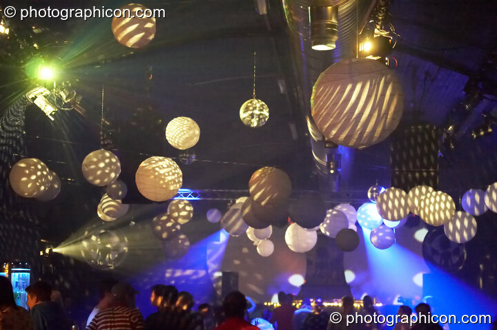 Dancers beneath the many hanging paper spheres decorating the Archangel^ & Nu-school Hippies room at Alpha Omega. London, Great Britain. © 2008 Photographicon