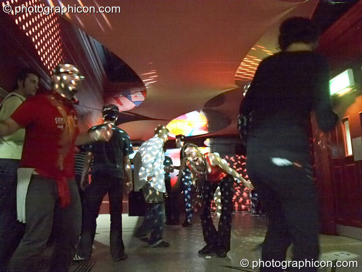 People dance under decor and light show by Extra Dimensional Space Agency in the Micro Prog Room at Future Music. London, Great Britain. © 2008 Photographicon