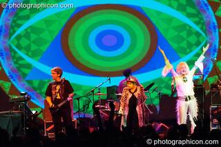 Steve Hillage, Gilli Smyth, Chris Taylor, and Daevid Allen of Planet Gong perform at the Kentish Town Forum with visual projections by ColourSound. London, Great Britain. © 2009 Photographicon