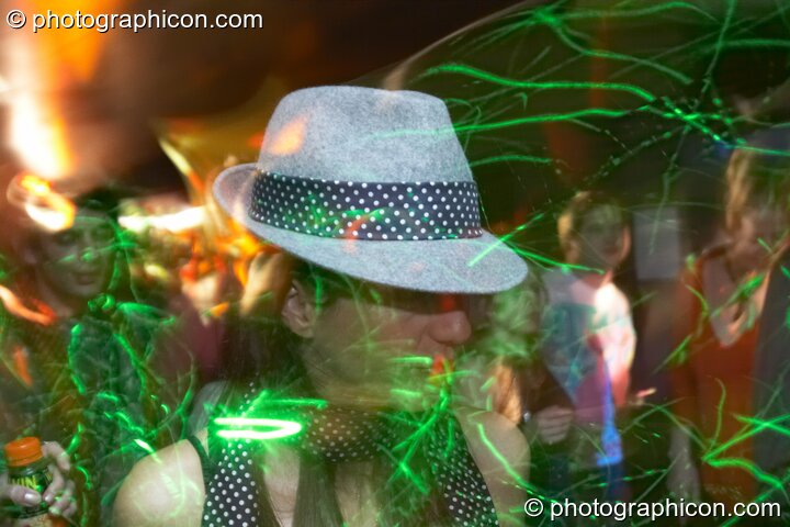 Dancers painted by laser light patterns in the Techno room at the Haiti Appeal Party 09/04/2010. London, Great Britain. © 2010 Photographicon