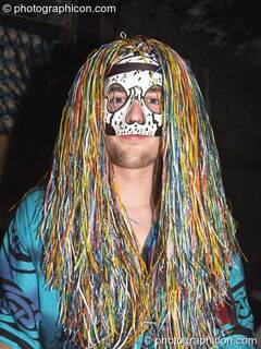 Mike wearing a tinsel wig and mask at the Synergy Project. London, Great Britain. © 2004 Photographicon
