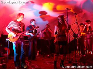 Matt Tweed (Mandoin), Tony Marrison (bass), Tello Maybe (trumpet), Maria João (vocals), and Sam Heath (drums) of Kamel Nitrate on the Small World Stage at The Synergy Project. London, Great Britain. © 2006 Photographicon
