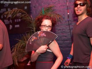 A woman dances with a fan at The Synergy Project. London, Great Britain. © 2006 Photographicon