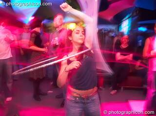 Natalie dances with a hula hoop at The Synergy Project. London, Great Britain. © 2006 Photographicon