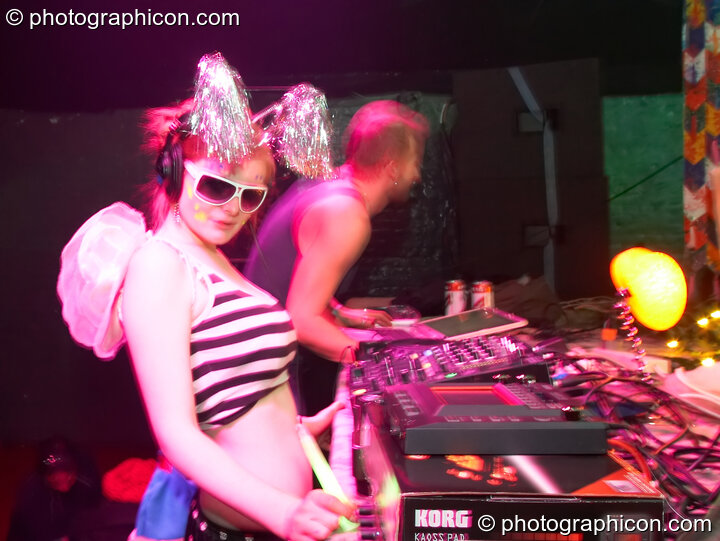 A random woman from the audience joins Telepathik behind the decks on the Kundalini stage at The Synergy Project. London, Great Britain. © 2007 Photographicon