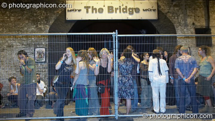 Smokers congregate in the caged area outside The Synergy Project. London, Great Britain. © 2007 Photographicon
