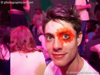 A man with a splodge painted eye at The Synergy Project. London, Great Britain. © 2007 Photographicon