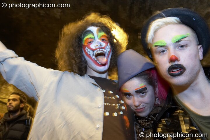 Revellers with painted faces queue in the tunnel outside at The Synergy Project. London, Great Britain. © 2007 Photographicon