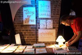 A man draws something he loves on a stall in the Inspiration Hall at Luminopolis (formerly The Synergy Project). London, Great Britain. © 2008 Photographicon