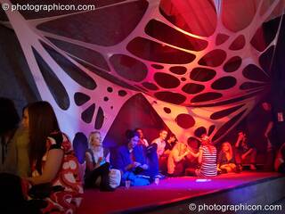 People chilling under webbed decor in the Ceilidh Project space at The Synergy Project. London, Great Britain. © 2007 Photographicon