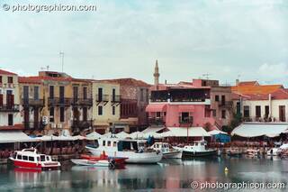 Boats and buildings reflected in the water of the harbour at Rethymno. Greece. © 2002 Photographicon