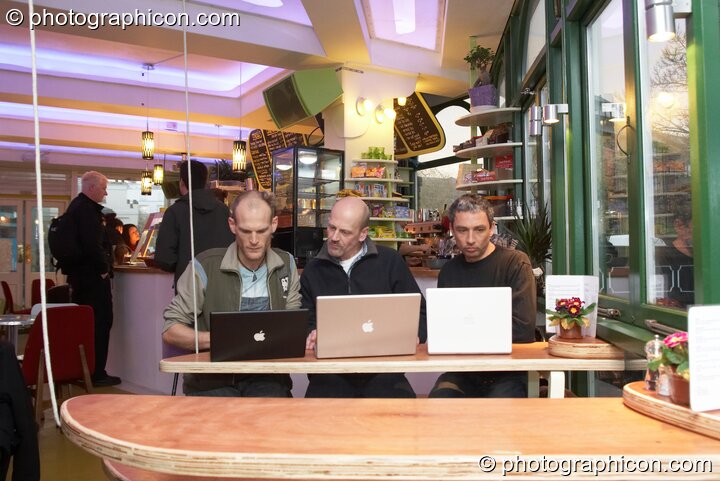 Three men work on their laptop computers in the inSpiral Lounge organic cafe and multimedia venue. London, United Kingdom. © 2008 Photographicon