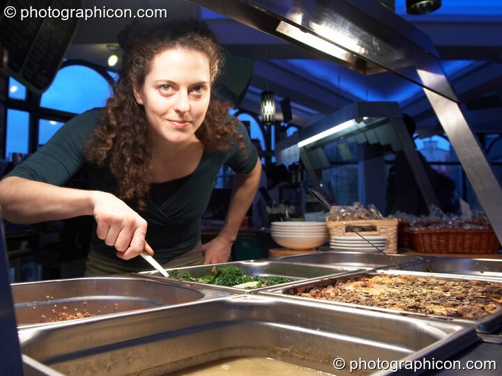 A woman serves wholesome food at the counter in the inSpiral Lounge organic cafe and multimedia venue. London, United Kingdom. © 2008 Photographicon