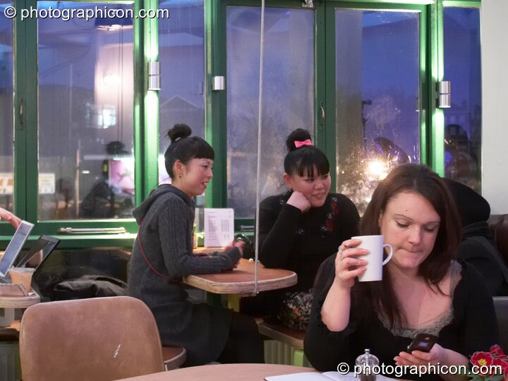 Three woman sit in the inSpiral Lounge organic cafe and multimedia venue. London, United Kingdom. © 2008 Photographicon