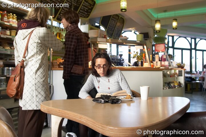 A woman reads a book in the inSpiral Lounge organic cafe and multimedia venue. London, Great Britain. © 2008 Photographicon
