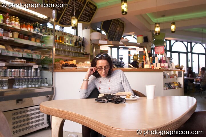 A woman reads a book in the inSpiral Lounge organic cafe and multimedia venue. London, Great Britain. © 2008 Photographicon