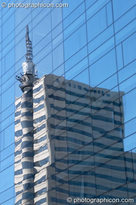 One building fully reflected by the windows of another in the centre of Cape Town - Western Cape, South Africa. © 2005 Photographicon