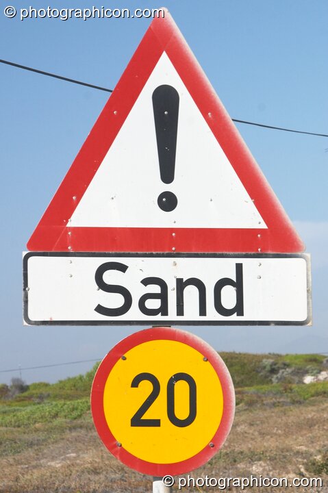 Sand warning sign a road along False Bay, Cape Town - Western Cape, South Africa. © 2005 Photographicon