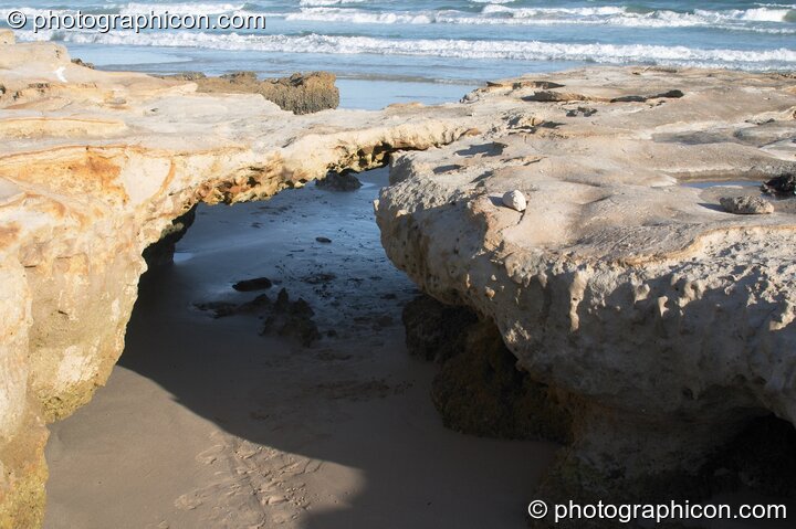 Water eroded hole in rocks on Mnandi Beach, Cape Town - Western Cape, South Africa. © 2005 Photographicon