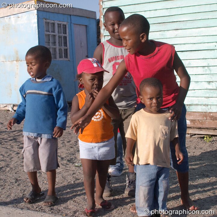 Children gather themselves on the Streets of Langa, Cape Flats, Cape Town - Western Cape, South Africa. © 2005 Photographicon