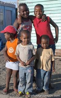 Children gather themselves on the Streets of Langa, Cape Flats, Cape Town - Western Cape, South Africa. © 2005 Photographicon