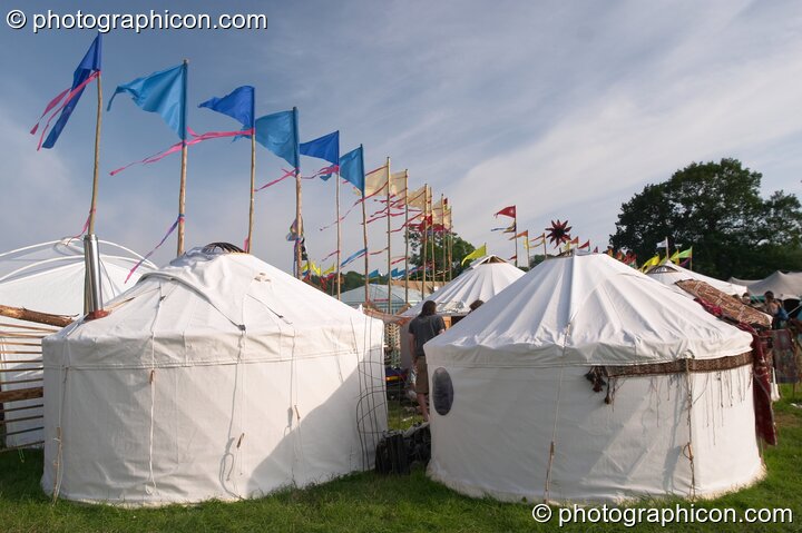 A row of yurts and flags in the Green Futures field at Glastonbury Festival 2005. Pilton, Great Britain. © 2005 Photographicon