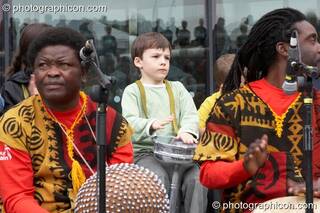 Shool kid performs with Kakatsitsi and Drum4Africa, a fundraising project for African children, at the Thames Festival 2005. London, Great Britain. © 2005 Photographicon
