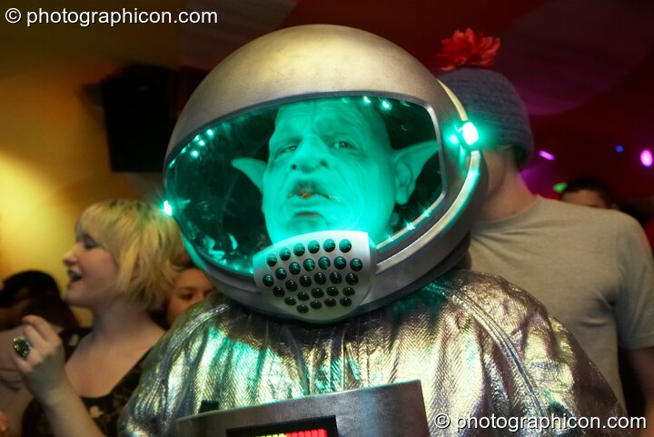 A man wearing an elaborate space-alien costume dances in the Galactic Fantastic room at The Synergy Project. London, Great Britain. © 2008 Photographicon