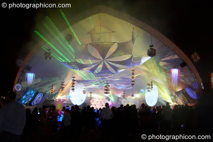 An external front view of lasers, lights, and decor in the Liquid Stage tent during a night time peformance at Glade Festival 2005. Aldermaston, Great Britain. © 2005 Photographicon