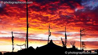 The sun sets over the Re-Crea8 tent at Big Green Gathering 2006. Burrington, Cheddar, Great Britain. © 2006 Photographicon