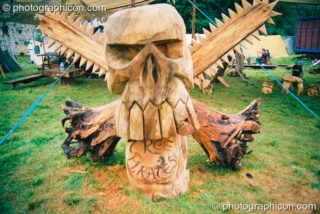 Dinosaur Park chainsaw sculpture by the Tree Pirates at Big Green Gathering 2003. Cheddar, United Kingdom. © 2003 Photographicon