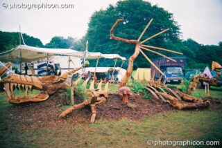Dinosaur Park chainsaw sculpture by the Tree Pirates at Big Green Gathering 2003. Cheddar, United Kingdom. © 2003 Photographicon