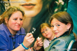 Simmone Kay paints faces at Big Green Gathering 2003. Cheddar, United Kingdom. © 2003 Photographicon
