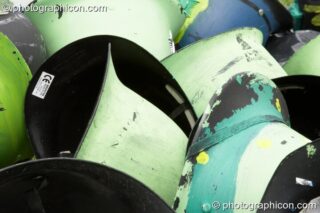 A pile of painted Green Police helmets at Big Green Gathering 2005. Burrington, Cheddar, United Kingdom. © 2005 Photographicon