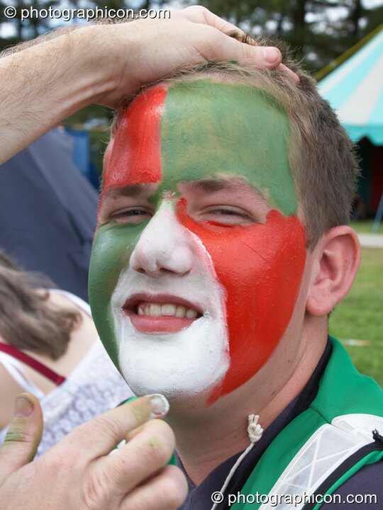 Aaron Perry of the Green Police has his face coloured at Big Green Gathering 2005. Burrington, Cheddar, United Kingdom. © 2005 Photographicon