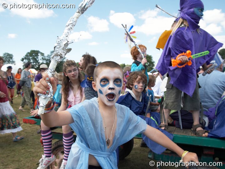 A group of kids dressed in costume on parade at Big Green Gathering 2005. Burrington, Cheddar, United Kingdom. © 2005 Photographicon