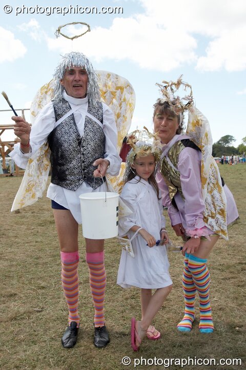 Man, woman, and child dressed as angels at Big Green Gathering 2005. Burrington, Cheddar, United Kingdom. © 2005 Photographicon