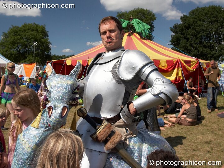 Man on stilts wearing a knight costume at Big Green Gathering 2005. Burrington, Cheddar, United Kingdom. © 2005 Photographicon