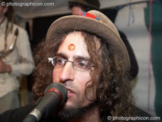 A musicians jams at Big Green Gathering 2005. Burrington, Cheddar, United Kingdom. © 2005 Photographicon