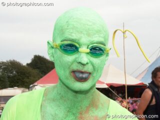 A man on a walkabout dressed as amphibians at Big Green Gathering 2006. Burrington, Cheddar, United Kingdom. © 2006 Photographicon