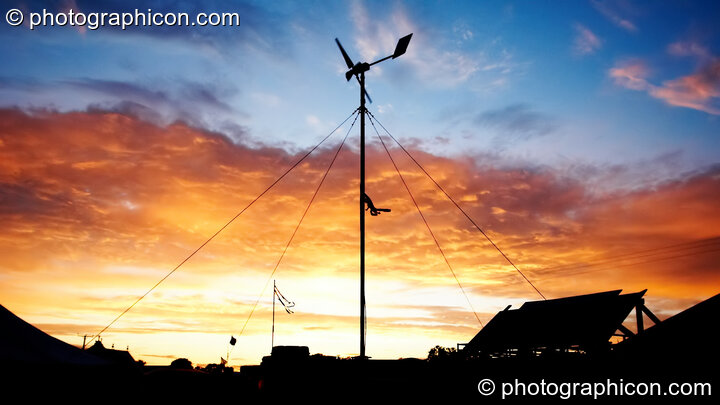 The Green Futures energy trailer against the setting sun at Big Green Gathering 2006. Burrington, Cheddar, United Kingdom. © 2006 Photographicon