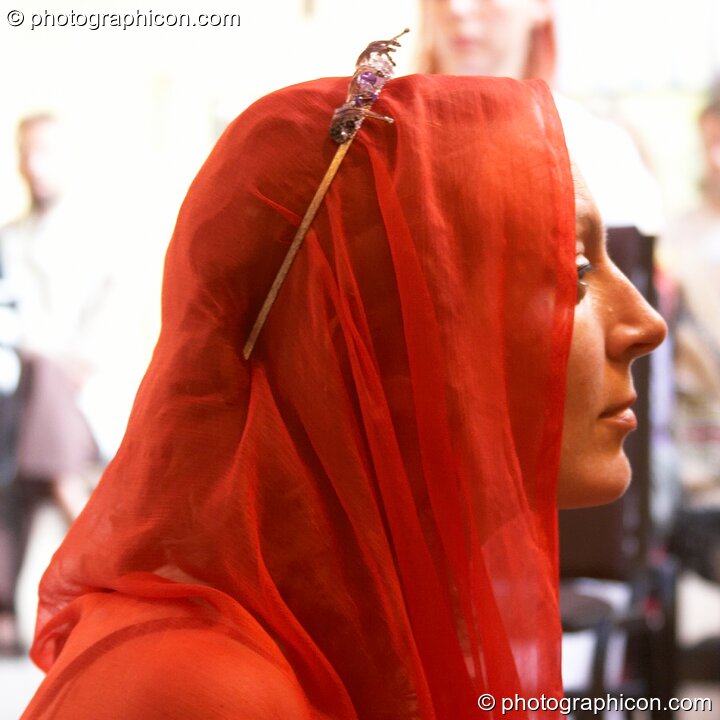 Woman in red head-scarf at the Feast of the Magdalene. Glastonbury, United Kingdom. © 2005 Photographicon