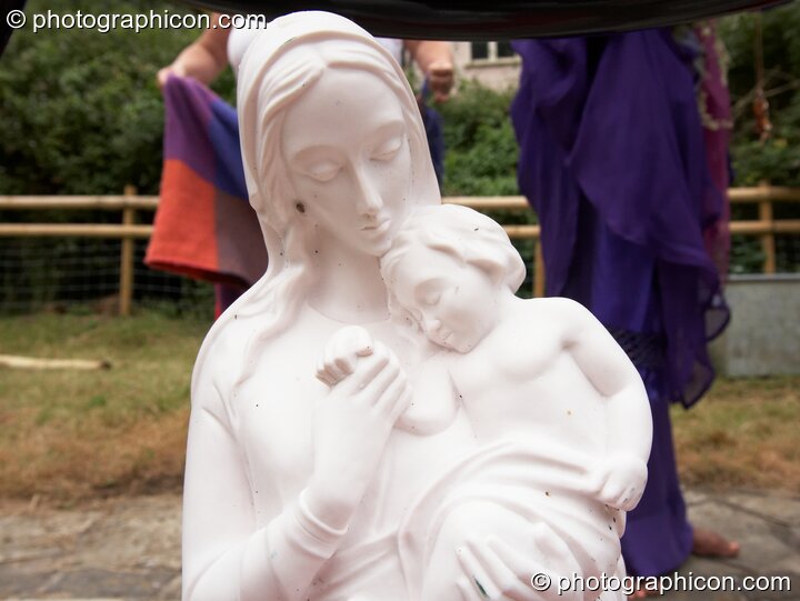 A small statue of Mary and child at the Feast of the Magdalene. Glastonbury, United Kingdom. © 2005 Photographicon