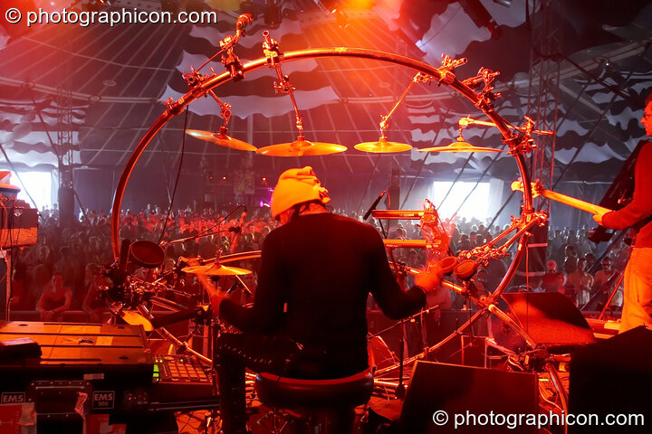 Andy Gangadeen (and his circular drum kit) of The Bays performing on the Main Stage with the tented audience in the background at Glade Festival 2005. Aldermaston, United Kingdom. © 2005 Photographicon