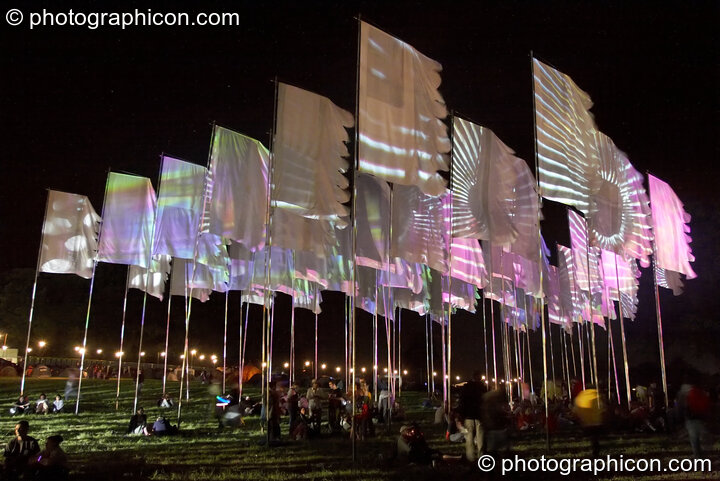 Projections by night on group of large flags at Glade Festival 2005. Aldermaston, United Kingdom. © 2005 Photographicon