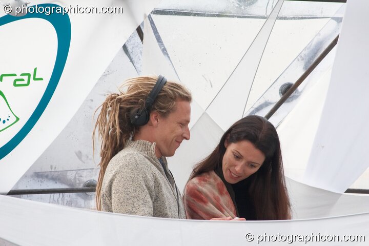 Nick & Nathalle Interchill share an affectionate moment while DJing on the idspiral stage at Glade Festival 2005. Aldermaston, United Kingdom. © 2005 Photographicon