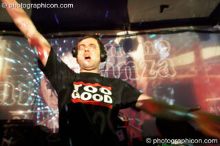 DJ TooGood plays against a backdrop of projections on the Sancho Panza Stage at Glade Festival 2005. Aldermaston, United Kingdom. © 2005 Photographicon