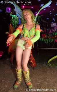 Girl in yellow fairy outfit dances by the Origin Stage at Glade Festival 2005. Aldermaston, United Kingdom. © 2005 Photographicon